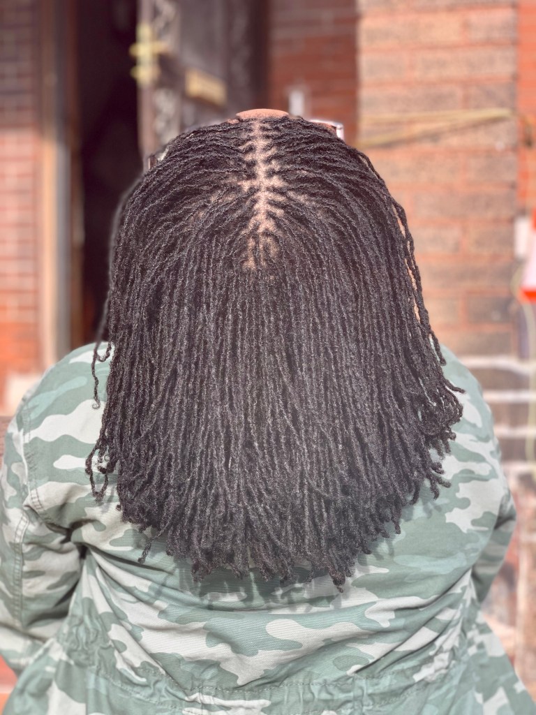 woman with head thrown back showing Sisterlocks